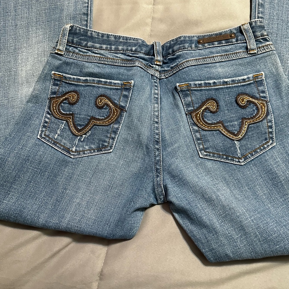 Blue Jeans w/brown designs on pockets, REROCK by Express. Size 8 Short.